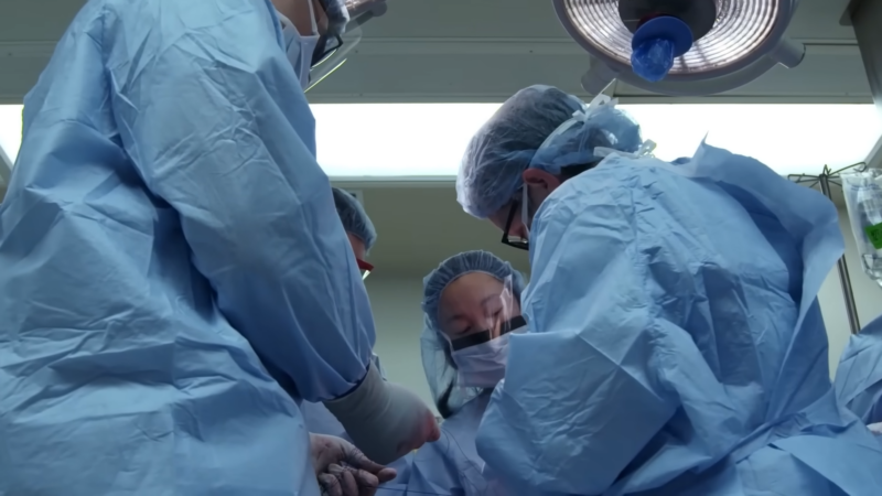 A Team of Surgeons Performing an Emergency Operation on A Gunshot Victim