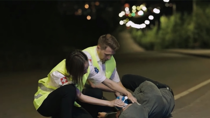 Emergency Responders Providing First Aid to A Gunshot Victim