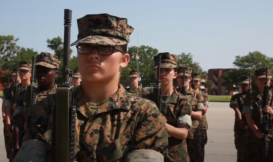 A formation of military personnel standing at attention