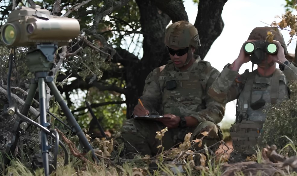 Two field artillery soldiers on military training