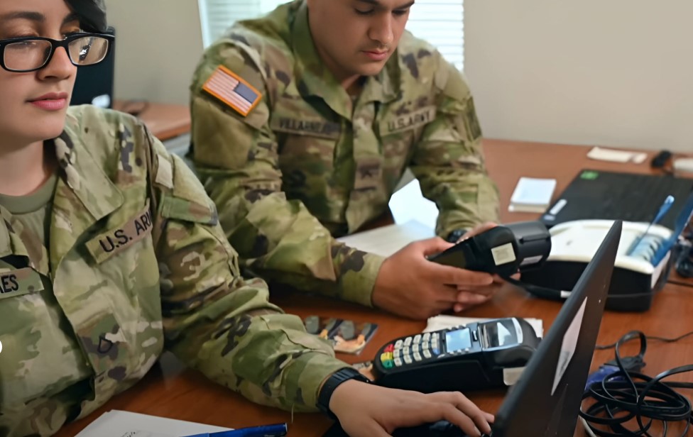 Finance Corps soldiers working in office