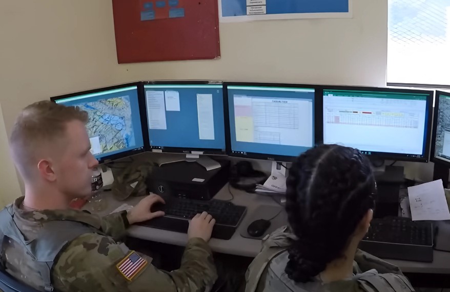 Adjutant General Corps soldiers working on paperwork in office