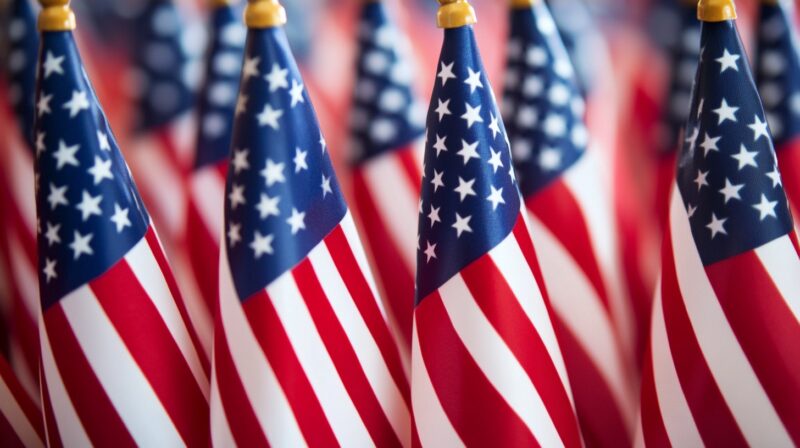 close-up view of multiple small American flags lined up, showcasing their vibrant colors and patterns