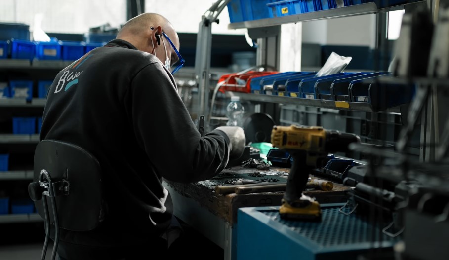 Worker in a gun factory