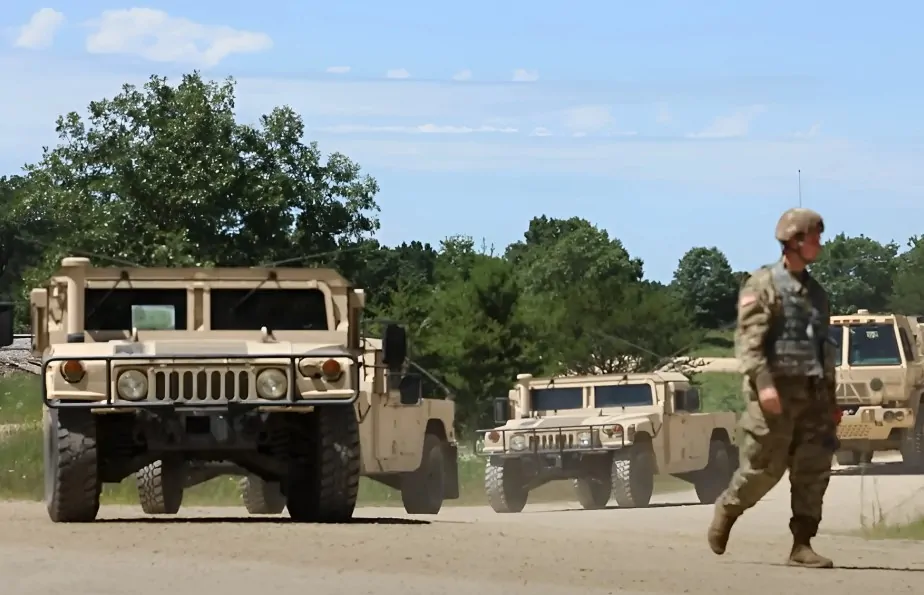 Transportation corps coming to the military base with vehicles