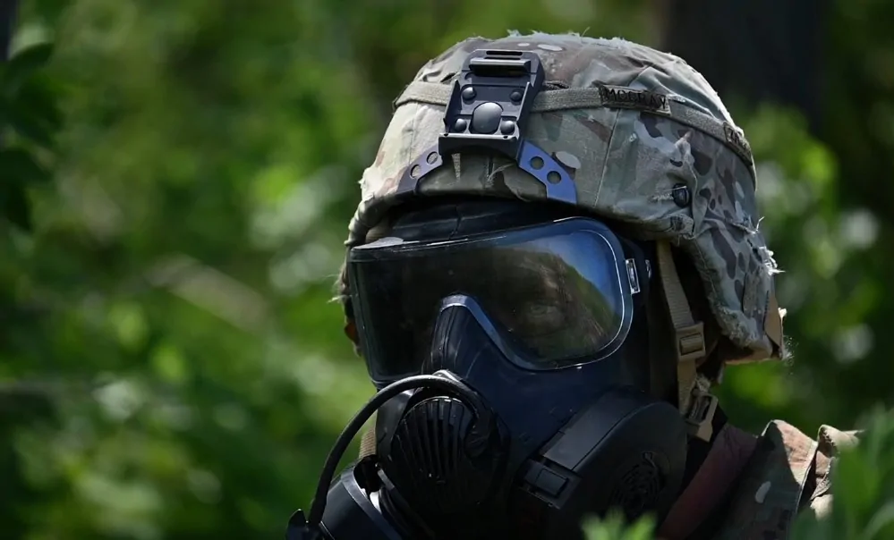 U.S. soldier wearing helmet and mask