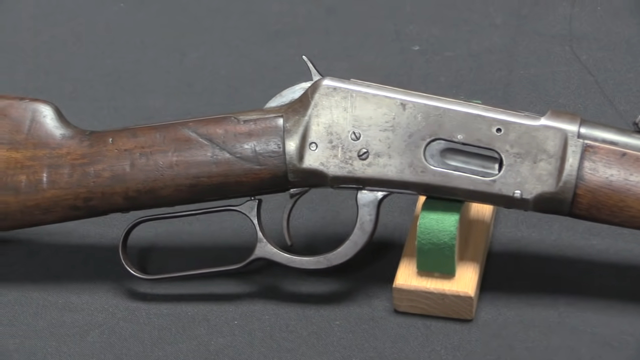 close-up of a Winchester Model 1894 lever-action rifle displayed on a stand