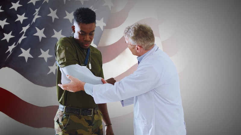 Doctor Assisting a Soldier with A Broken Arm, Set Against the Backdrop of The American Flag, Representing the Impact of Off-Duty Injuries on Military Benefits