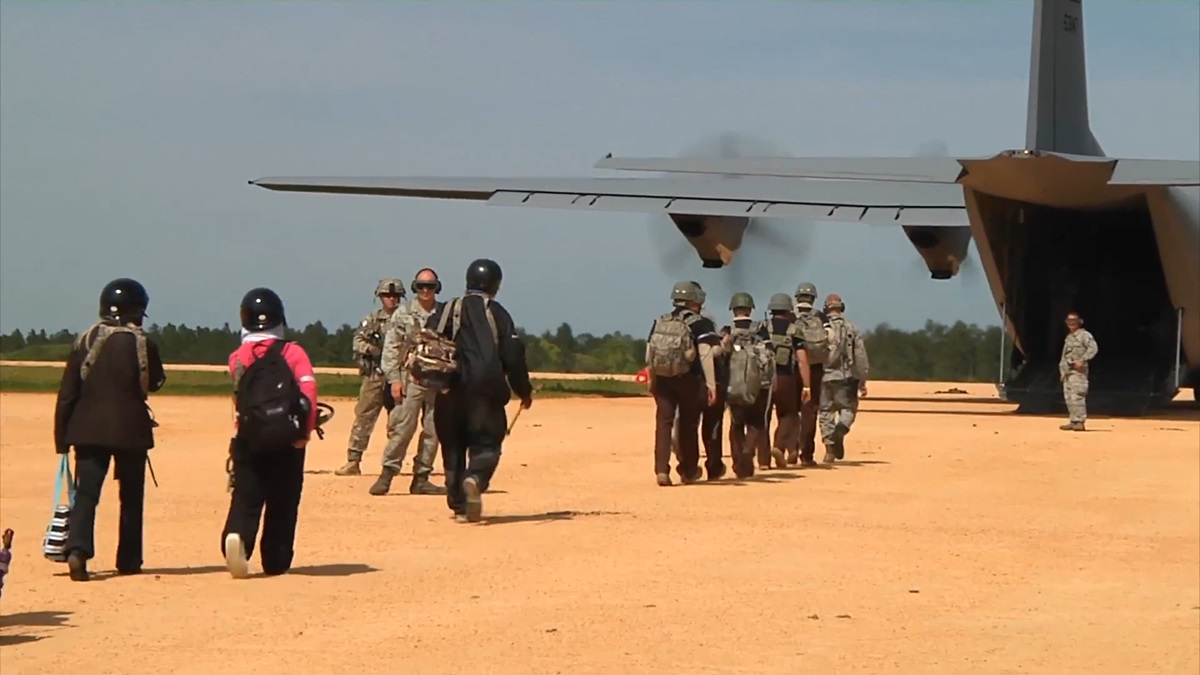 Soldiers boarding a military aircraft for a paratrooper training exercise