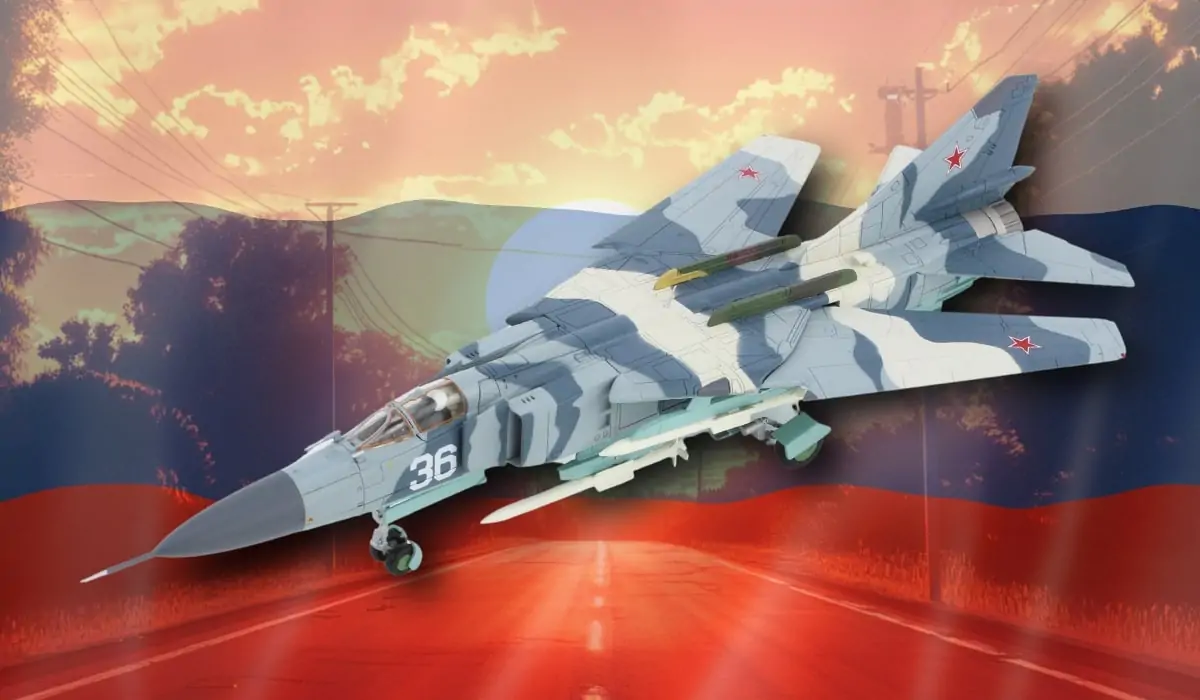 A Russian MiG-23 Flogger fighter jet with camouflage paint, flying over a background featuring the Russian flag