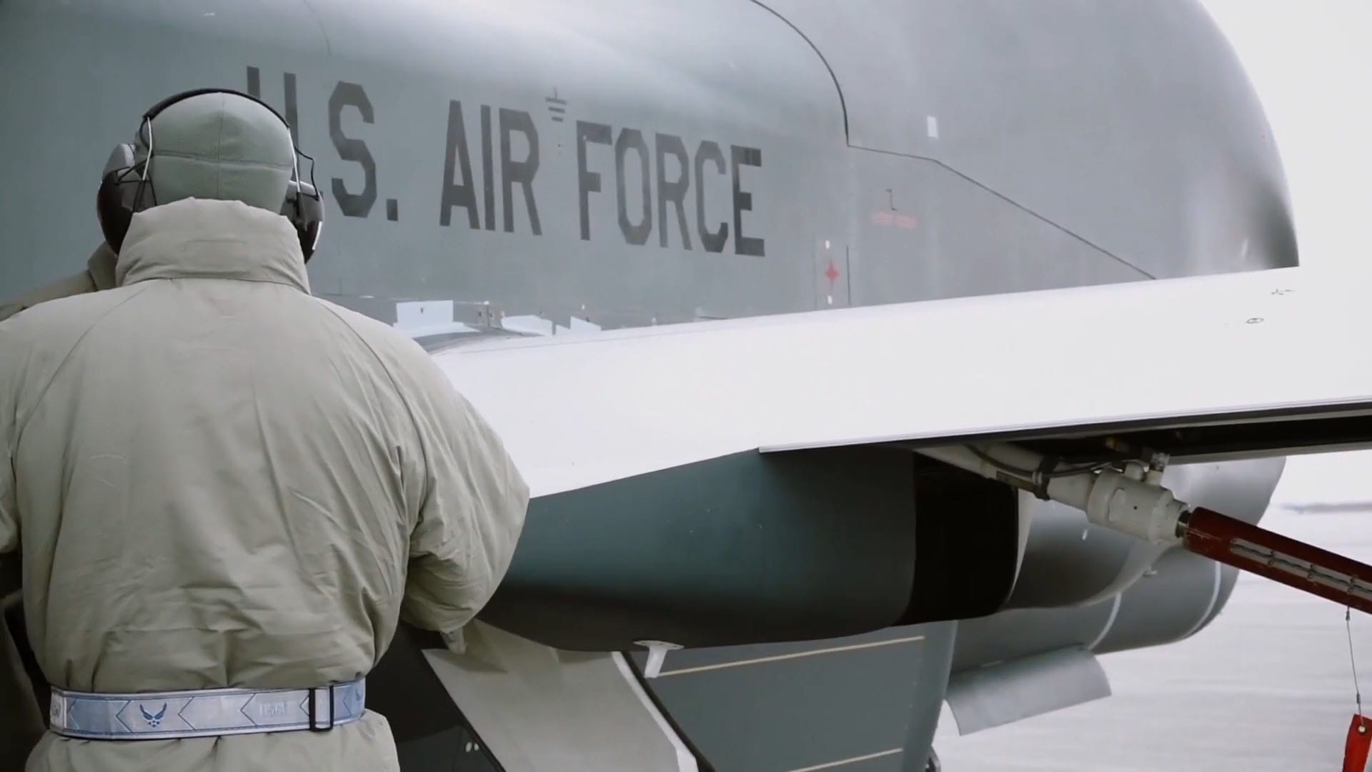 Close-up view of "U.S. Air Force" text on the side of an aircraft, with a Military TV logo in the corner