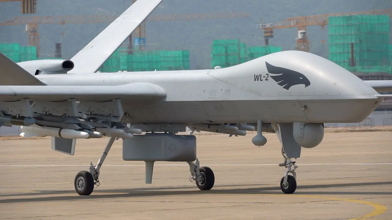 A Wing Loong II unmanned aerial vehicle (UAV) on the tarmac, armed with multiple missiles and surveillance equipment